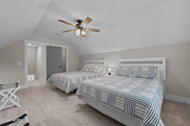 carpeted bedroom featuring vaulted ceiling and ceiling fan