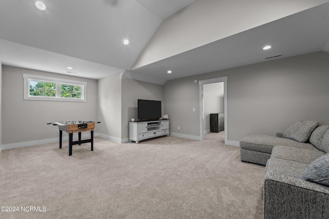 living room with light carpet and vaulted ceiling