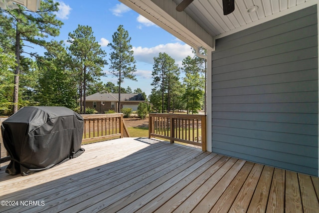 wooden terrace featuring area for grilling