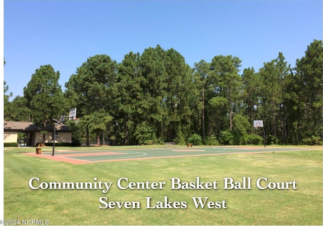 view of home's community featuring a yard and basketball court