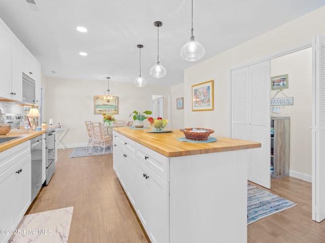 kitchen with white cabinetry, butcher block counters, light wood finished floors, baseboards, and dishwasher