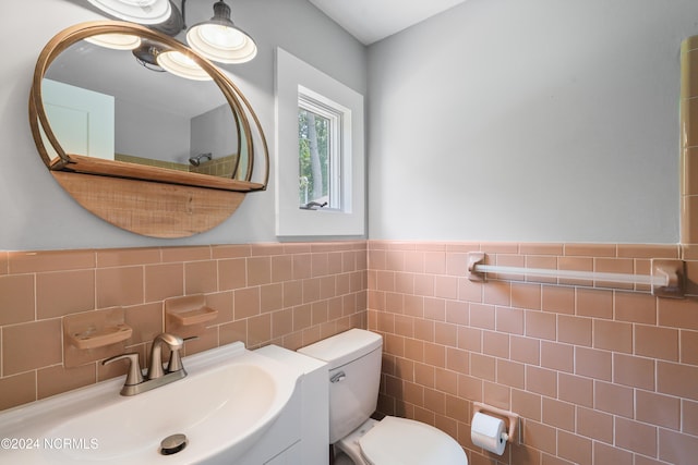 bathroom with backsplash, tile walls, toilet, and vanity