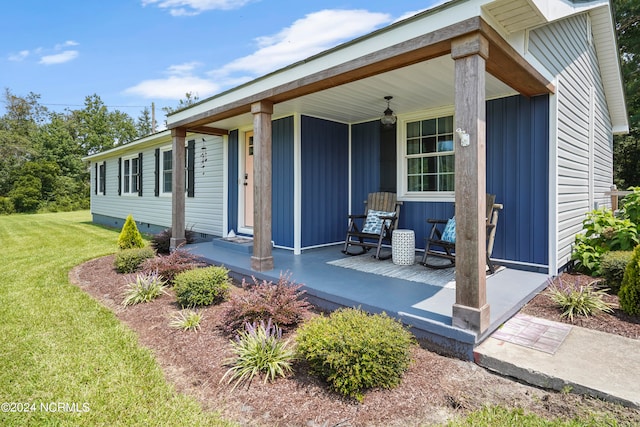 view of front of house featuring a front lawn and a porch