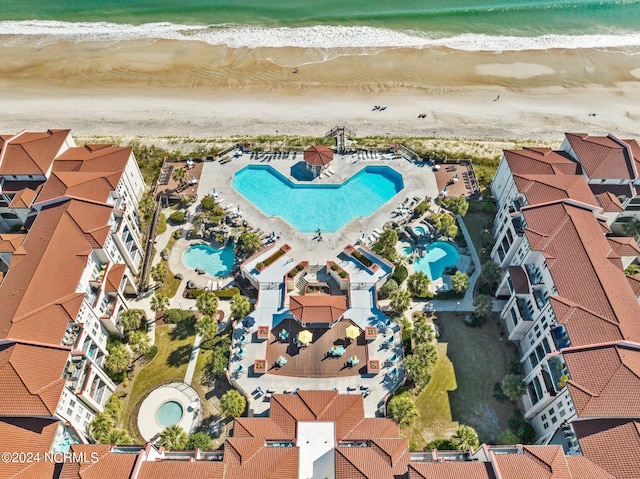 bird's eye view featuring a beach view and a water view