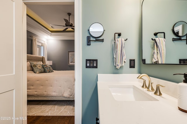 600 Planters Ridge Dr, Sunset Beach, NC 28468 - ensuite bathroom featuring a ceiling fan, crown molding, wood finished floors, vanity, and connected bathroom