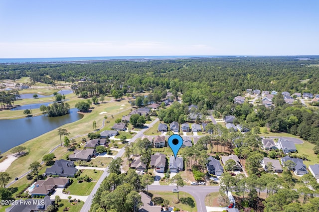 600 Planters Ridge Dr, Sunset Beach, NC 28468 - drone / aerial view featuring a forest view, a residential view, view of golf course, and a water view