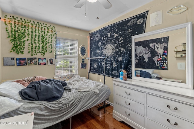 bedroom featuring a ceiling fan and wood finished floors