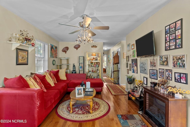 living room with a ceiling fan and wood finished floors