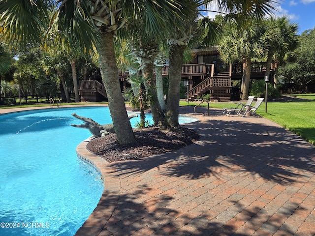 7422 Sea Lilly Ln, Wilmington, NC 28409 - pool featuring a yard, a patio, a wooden deck, and stairs