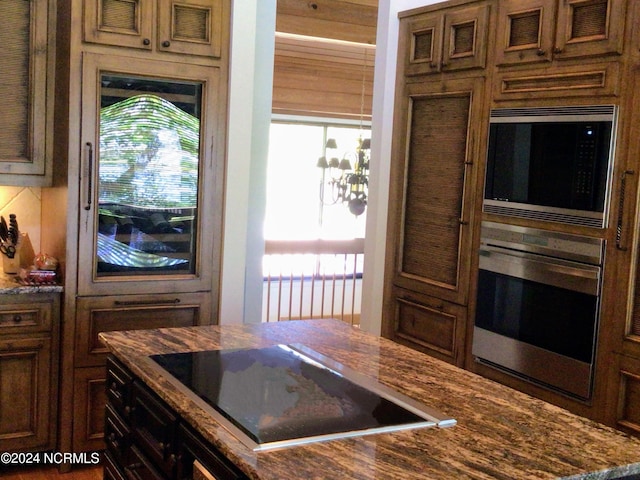 7422 Sea Lilly Ln, Wilmington, NC 28409 - kitchen featuring stainless steel appliances and dark stone countertops