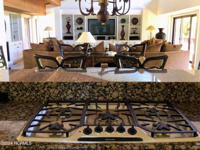 7422 Sea Lilly Ln, Wilmington, NC 28409 - interior space featuring gas cooktop, open floor plan, and a chandelier