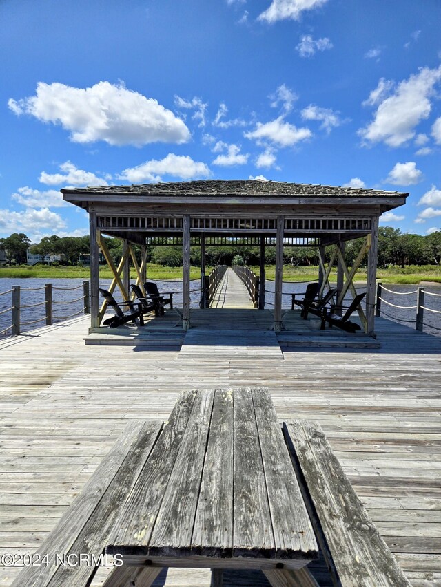 view of dock with a water view