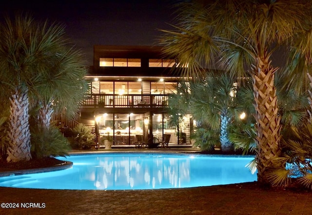 7422 Sea Lilly Ln, Wilmington, NC 28409 - pool at night with an outdoor pool