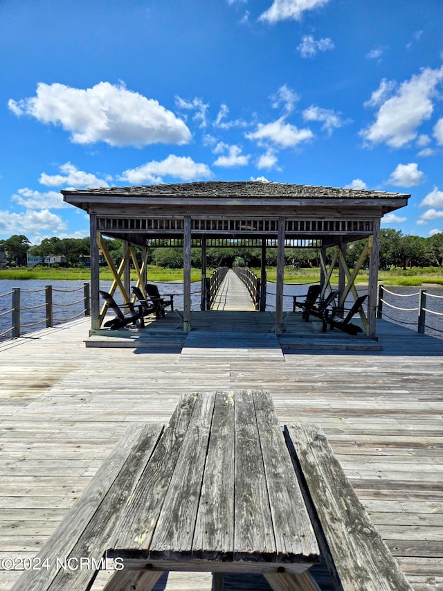 dock area with a deck with water view