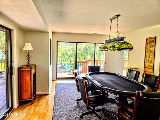 7422 Sea Lilly Ln, Wilmington, NC 28409 - playroom featuring a textured ceiling, light wood-style flooring, and a wealth of natural light