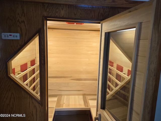 view of sauna featuring wood walls