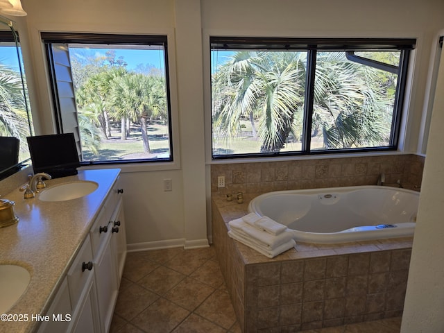 7422 Sea Lilly Ln, Wilmington, NC 28409 - bathroom featuring baseboards, a sink, tile patterned flooring, and a wealth of natural light