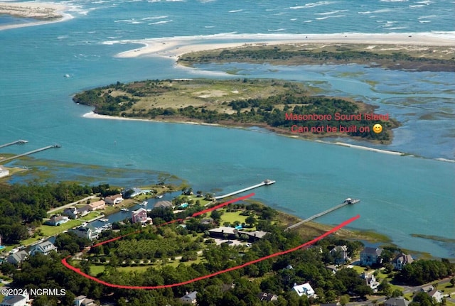 bird's eye view featuring a beach view and a water view