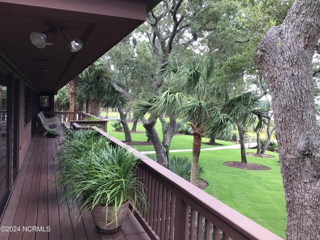 view of gate featuring a lawn