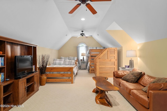 bedroom with light carpet, ceiling fan, and lofted ceiling