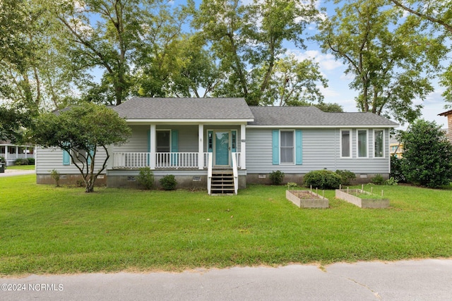 ranch-style home with a porch and a front yard