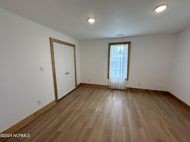 spare room featuring light hardwood / wood-style floors