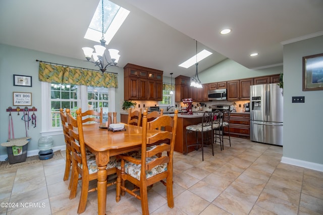 dining room featuring vaulted ceiling with skylight, a notable chandelier, and light tile patterned floors