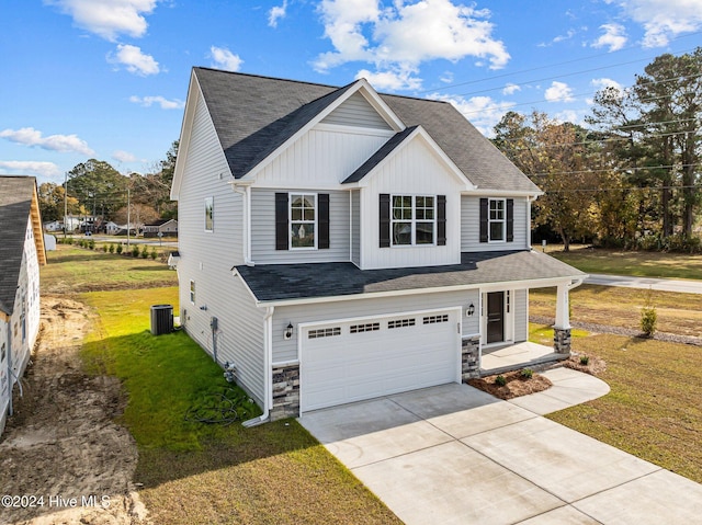 view of front facade with a front yard and a garage