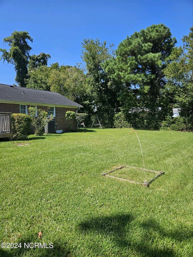 view of yard featuring central AC