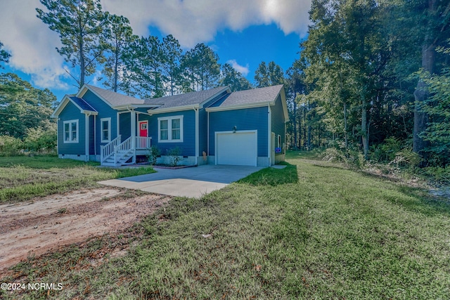 single story home with crawl space, an attached garage, driveway, and a front yard