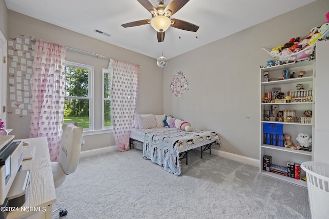 carpeted bedroom featuring visible vents, baseboards, and ceiling fan