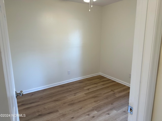 unfurnished room featuring hardwood / wood-style floors