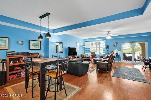 dining area with light wood-type flooring and ceiling fan