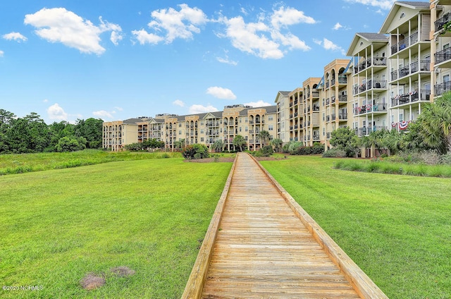 view of home's community featuring a yard