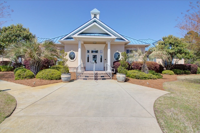 view of front of home with a porch and a front yard