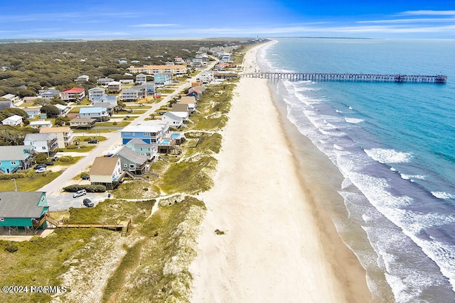 bird's eye view featuring a view of the beach and a water view