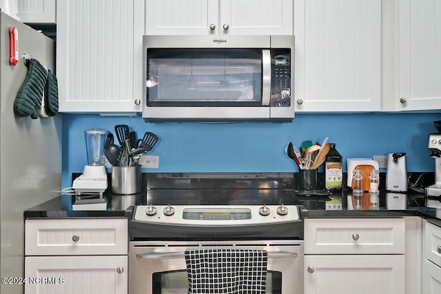 kitchen with appliances with stainless steel finishes and white cabinets