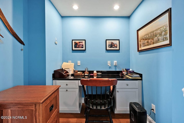 office space with dark wood-type flooring