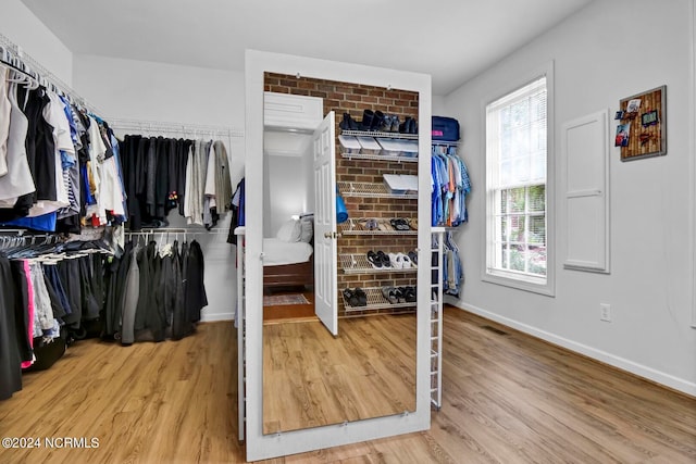 spacious closet featuring light wood-type flooring