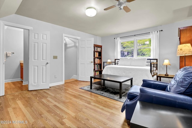 bedroom with ceiling fan and light hardwood / wood-style floors