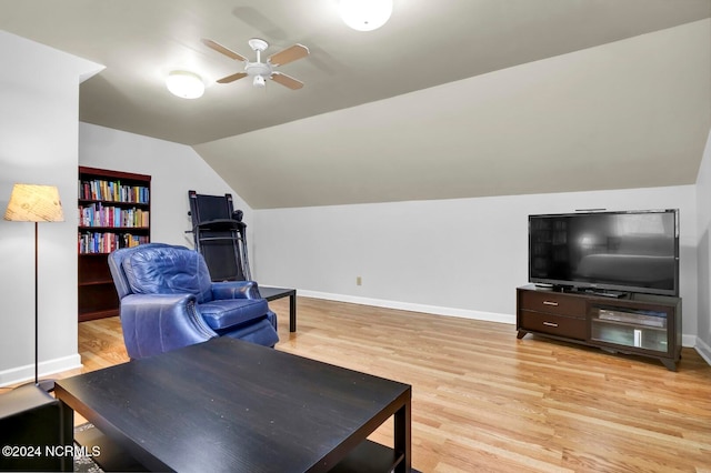 living room featuring lofted ceiling, light hardwood / wood-style flooring, and ceiling fan