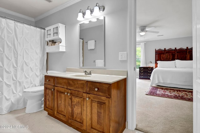 bathroom with crown molding, tile patterned floors, toilet, ceiling fan, and vanity