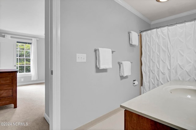 bathroom with crown molding, vanity, and curtained shower