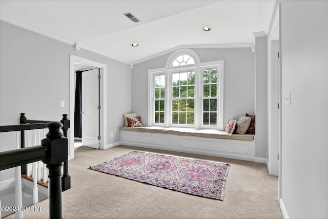 living area with lofted ceiling, light colored carpet, and crown molding