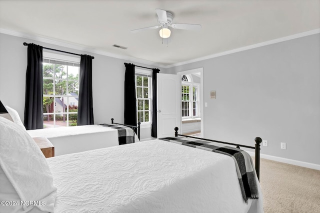 bedroom featuring ornamental molding, ceiling fan, and carpet