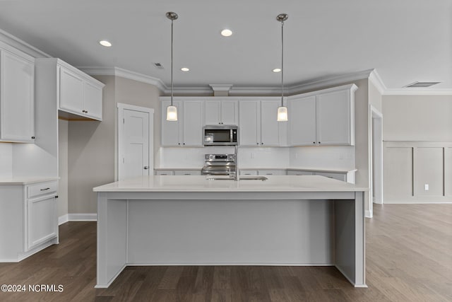 spare room featuring crown molding and hardwood / wood-style floors