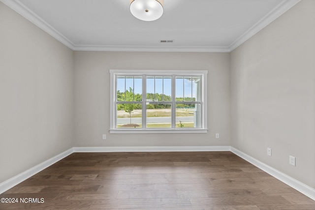 unfurnished bedroom with a raised ceiling, ceiling fan, ornamental molding, and multiple windows