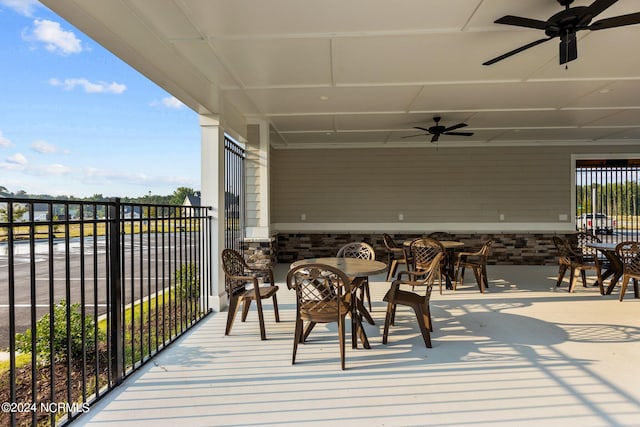 exterior space with ceiling fan