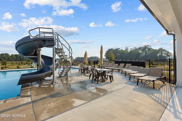 view of patio with a community pool