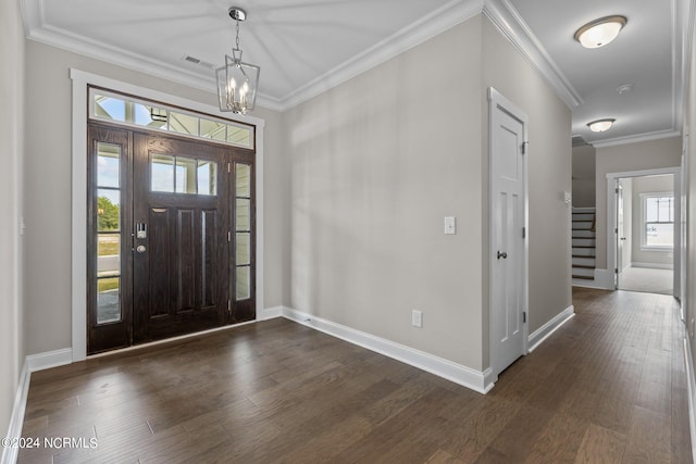 kitchen featuring decorative light fixtures, a center island with sink, sink, white cabinetry, and appliances with stainless steel finishes